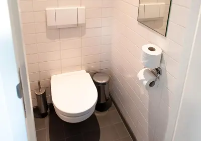 a bathroom with a toilet and two rolls of toilet paper at SWEETS - Zeilstraatbrug in Amsterdam