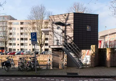 a building with a staircase next to some bikes at SWEETS - Zeilstraatbrug in Amsterdam