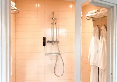 a bathroom with a shower with a shower head at SWEETS - Overtoomsesluis in Amsterdam