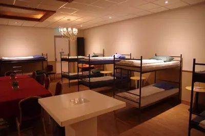 a room with several bunk beds on the wall at Hostel 45 in Purmerend