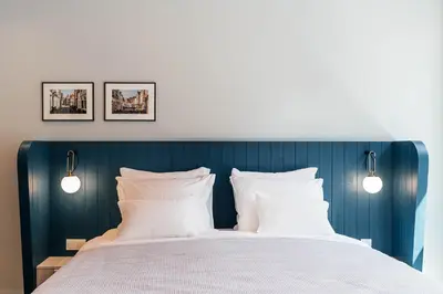 a bedroom with a bed with two white pillows at Cozy Pillow in Utrecht