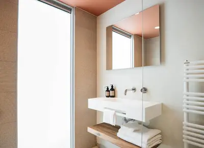 a bathroom with a sink and a mirror at Cozy Pillow in Utrecht