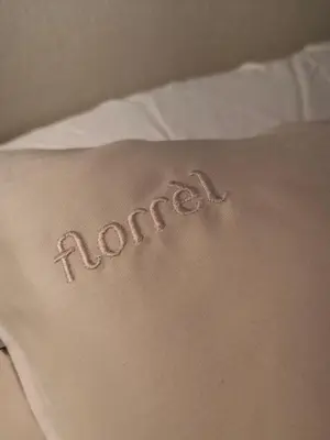 a back tattoo of the word rooster written on a bed at LandLust Guesthouse B&B Amsterdam Area Purmerend in Purmerend