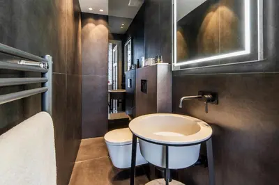 a bathroom with a sink and a toilet at Amstel Corner Hotel in Amsterdam