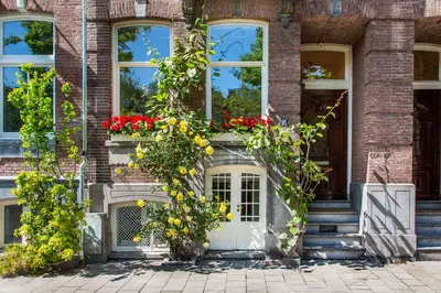 a house with flowers on the front door at Amstel Corner Hotel in Amsterdam