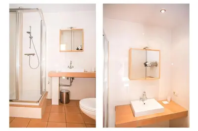 a bathroom with a shower and a sink and a toilet at Near the Beach in Zandvoort