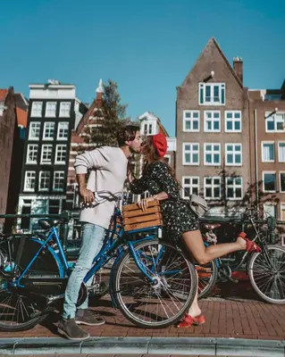 a man and a woman on a bike at Andaz Amsterdam, Prinsengracht, By Hyatt in Amsterdam