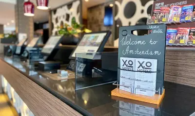 a display case in a store with a sign at XO Hotels Park West in Amsterdam