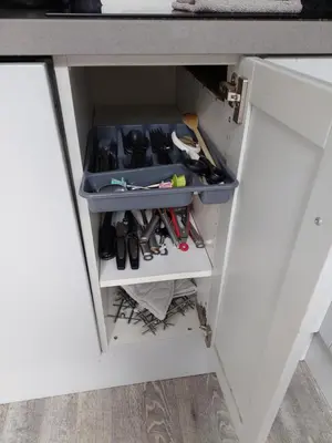 a drawer in a kitchen with tools in it at JaBaKi Garden House in Hoofddorp