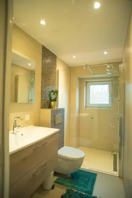 a bathroom with a toilet and a sink and a shower at B&B Gabriela Amsterdam in Amsterdam