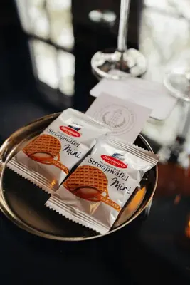 two bags of food on a plate on a table at 1637: Historic Canal View Suites in Amsterdam