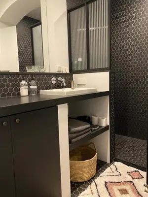 a bathroom with a sink and a mirror at Amstel Boutique Studio in Amsterdam