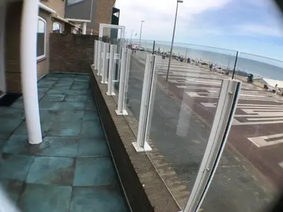 a view of the beach from a window at Beach Apartments Seaview in Zandvoort