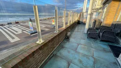 a balcony with chairs and a view of the ocean at Beach Apartments Seaview in Zandvoort