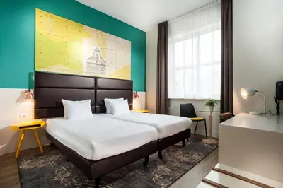 a hotel room with a bed and a large window at Best Western Zaan Inn, Amsterdam - Zaandam in Zaandam