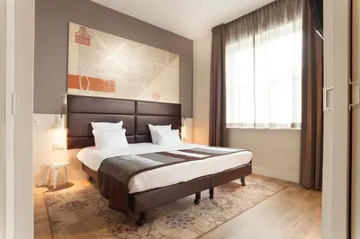 a bedroom with a large bed and a window at Best Western Zaan Inn, Amsterdam - Zaandam in Zaandam