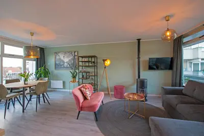 a living room with a couch and a table at Amsterdam Beach Apartment 90 in Zandvoort