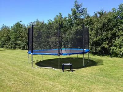 a trampoline in the middle of a field at Villa in Schoorldam with Garden in Schoorldam