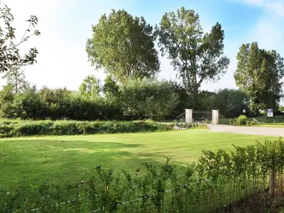 a large grassy field with a soccer goal at Villa in Schoorldam with Garden in Schoorldam
