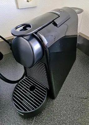a black toaster sitting on the floor at Zeehuis Appartement & Studio in Zandvoort