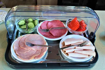 a tray of food with meat and vegetables on a table at Mps Holland in Amsterdam