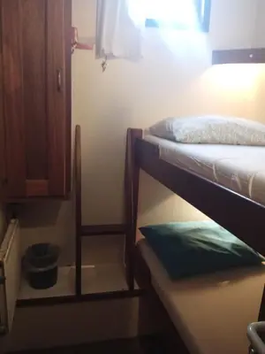 a room with two bunk beds and a cabinet at Mps Holland in Amsterdam