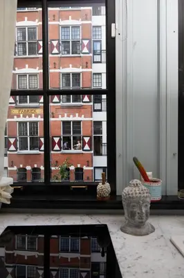 a view of a building from a window at Redlightdistrict chinacitycentre partypalace in Amsterdam