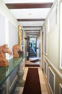 a hallway with statues on a counter in a house at Redlightdistrict chinacitycentre partypalace in Amsterdam