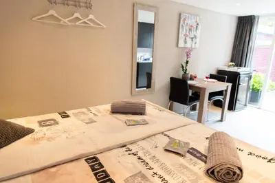 a room with a bed and a table with a table at Studio Excellent 21 in Soesterberg