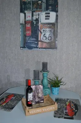 a table with two bottles of wine and a box at Bed & Breakfast ‘t Westergouwertje in Gouda