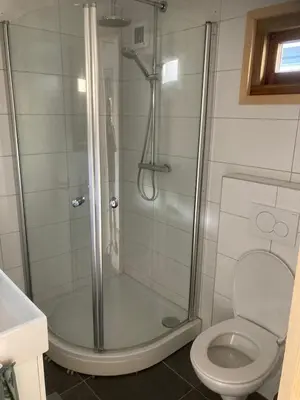 a bathroom with a shower and a toilet at Bed & Breakfast ‘t Westergouwertje in Gouda