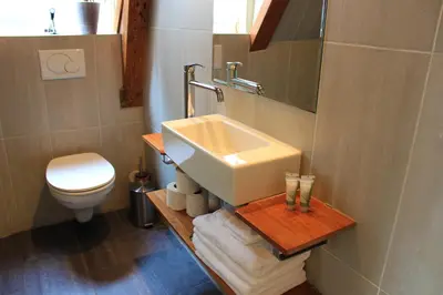 a bathroom with a sink and a toilet at Amsterdam Jewel Canal Apartments in Amsterdam