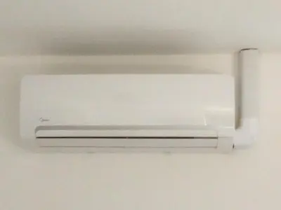 a white air conditioner hanging from a ceiling at Houseboat Little Amstel in Amsterdam