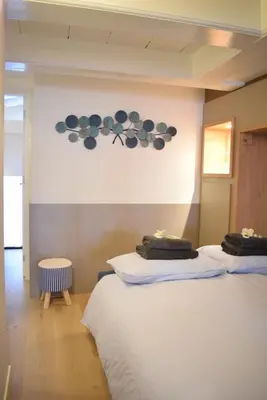 a bedroom with two beds with towels on them at Singel Residence in Amsterdam