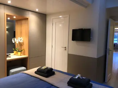 a bedroom with a bed with two towels on it at Singel Residence in Amsterdam