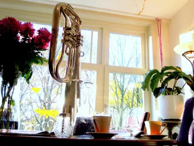 a kitchen counter with a faucet on a table at MissOrtelia B&B in Amsterdam
