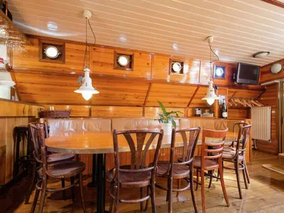 a dining room with a table and chairs at Boat in Leiden near City Center & Museums in Leiden