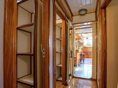 a hallway with shelves and a door to a room at Boat in Leiden near City Center & Museums in Leiden