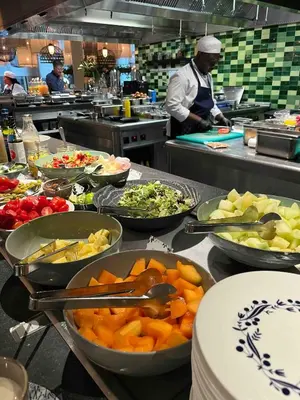 a kitchen with many bowls of food on a counter at Spinoza Suites in Amsterdam