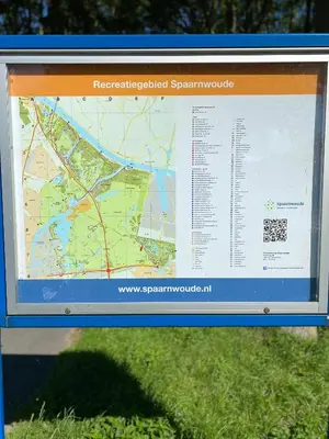 a sign with a map on it in the grass at Hotel de Keizerskroon Amsterdam-Schiphol-Halfweg in Halfweg