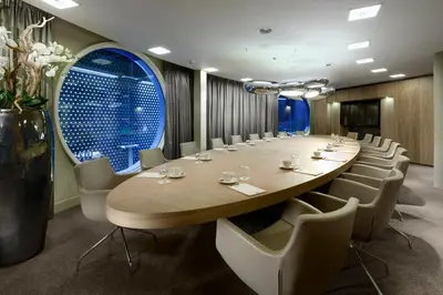 a large conference room with a long table and chairs at Fletcher Hotel Amsterdam in Amsterdam