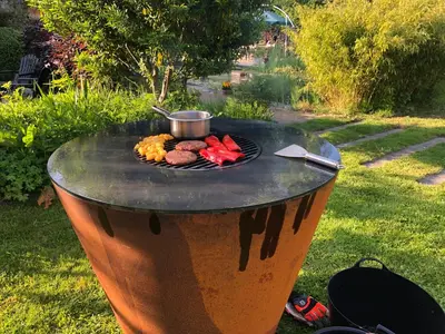 a table with a grill with food on it at De Aagt Tuyn in Schoorl