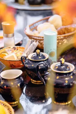 a table topped with cups and bowls of food at Design B&B Naarden Vesting in Naarden
