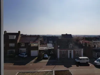 a view of a city with houses and cars at By Simonis in Zandvoort