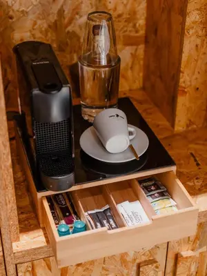 a table with a computer mouse and a speaker at Hotel Fita in Amsterdam