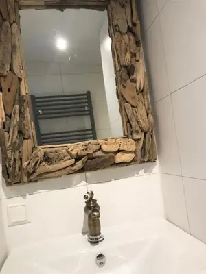 a bathroom with a mirror above a sink at Beach House Milou zandvoort Private Parking in Zandvoort