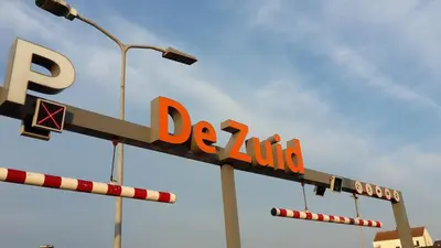 a sign for a del taco restaurant with a street light at Holiday Beach House in Zandvoort