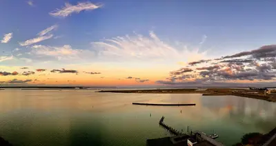 a view of a large body of water at sunset at Four Elements Hotel in Amsterdam