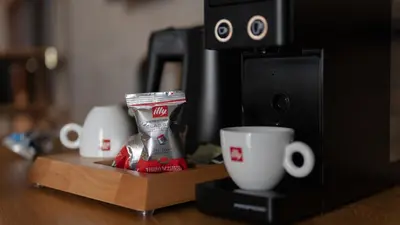 a coffee maker with two cups on a counter at Four Elements Hotel in Amsterdam