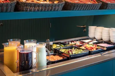 a buffet with many different types of food and drinks at Olympic Hotel in Amsterdam